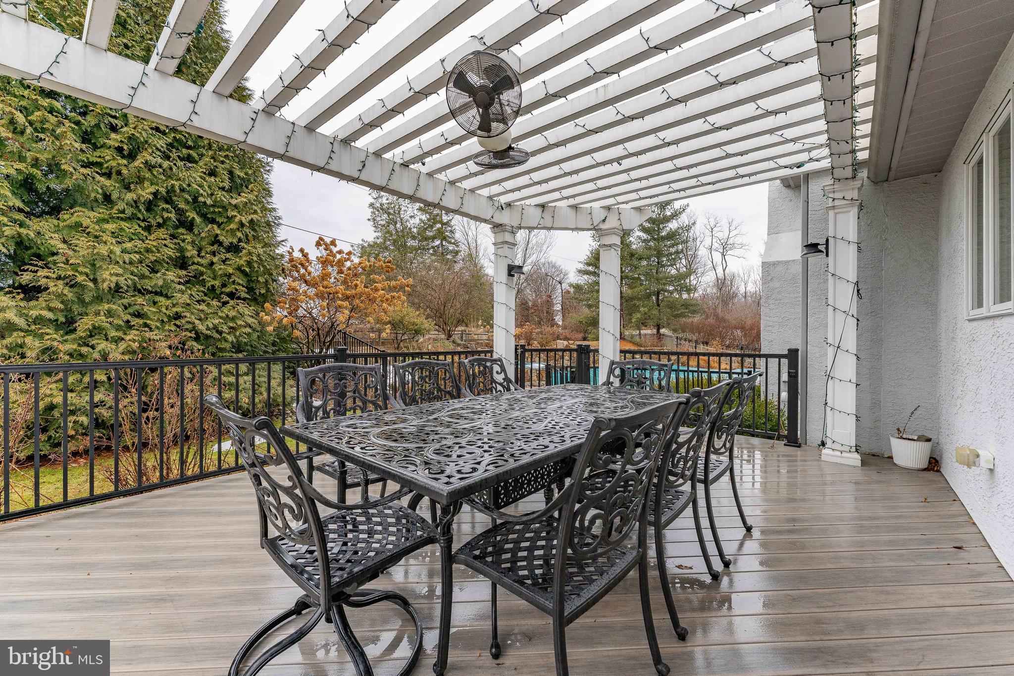 300 Bell Court Exton, PA 19341 - Photo 68 of 79 a patio with wooden floor a yard a table and chairs