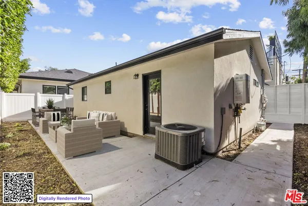 a view of living room with furniture and a rug