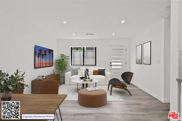 a living room with furniture rug and window
