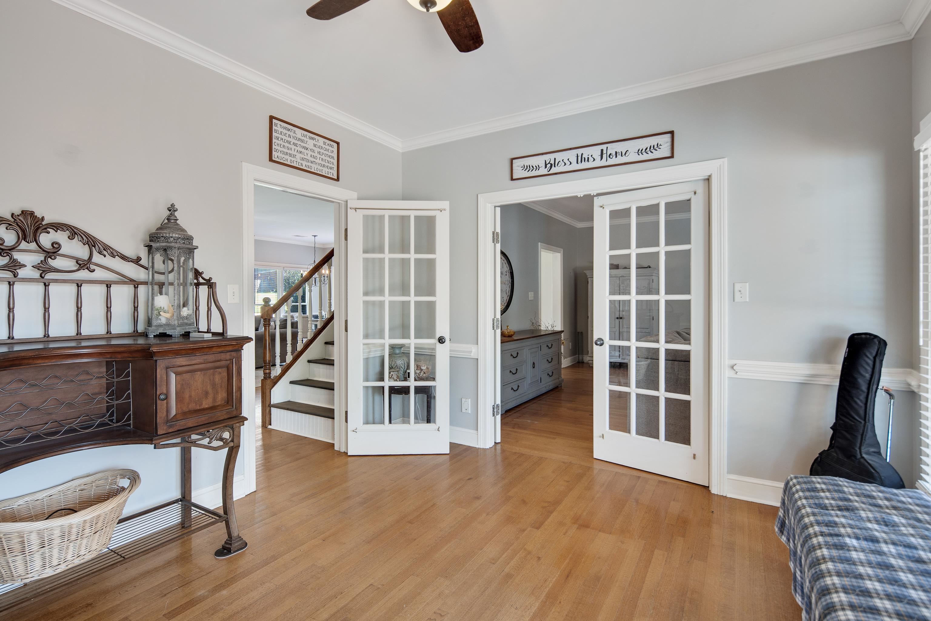 1323 Colbert Cove Collierville, TN 38017 - Photo 13 of 40 Bedroom featuring french doors, light hardwood / wood-style floors, ceiling fan, and crown molding