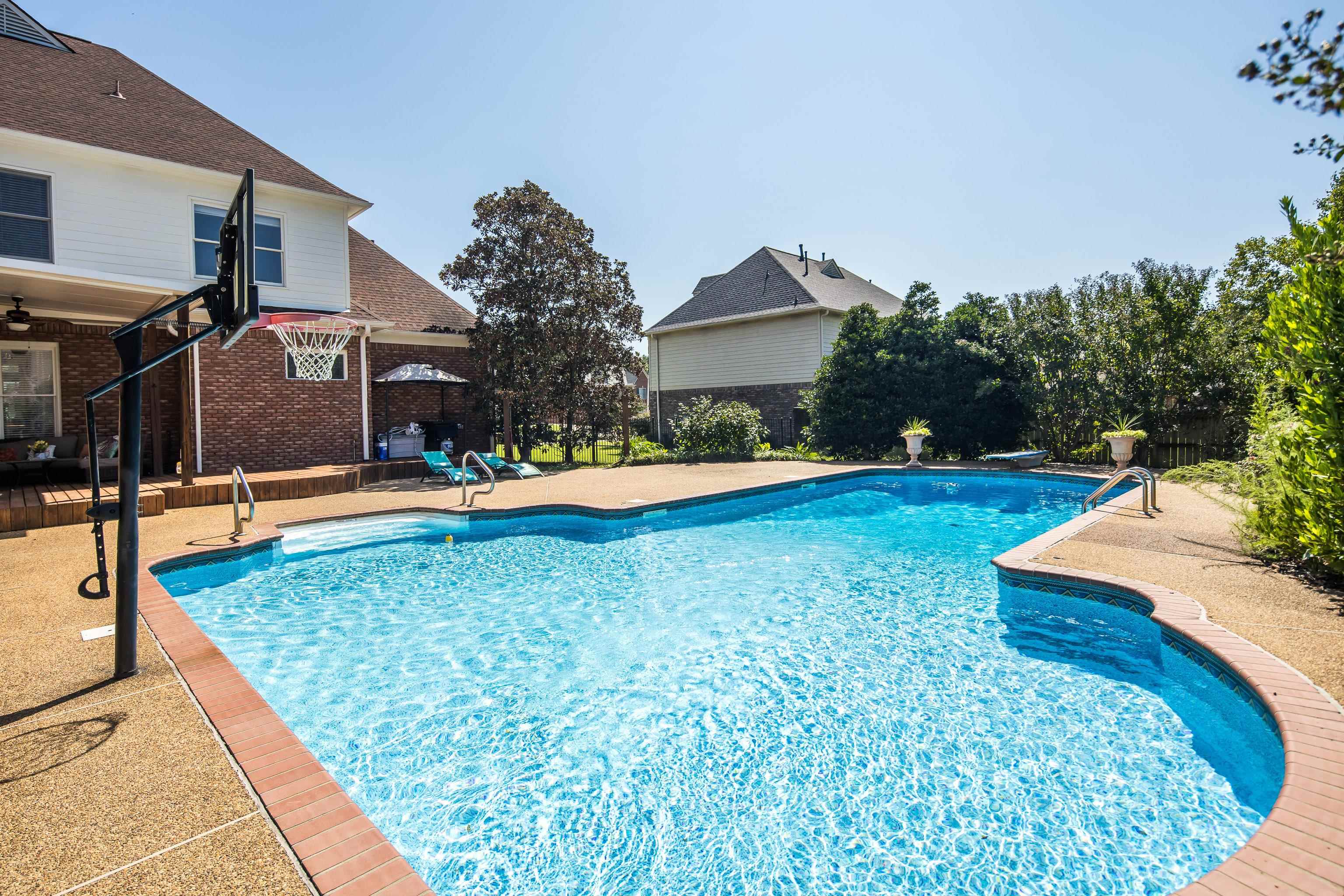 View of pool featuring a patio area and a diving board