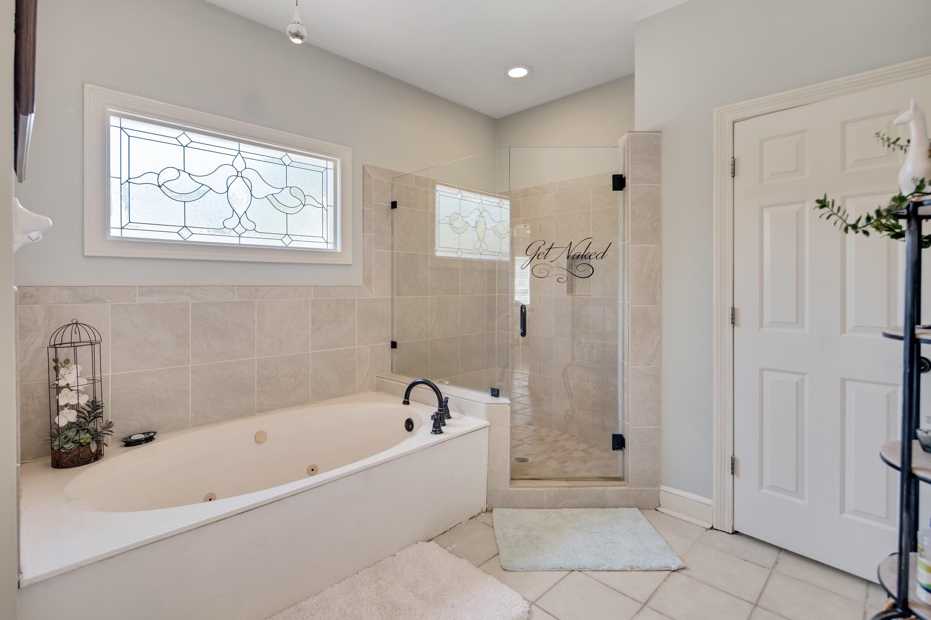 1323 Colbert Cove Collierville, TN 38017 - Photo 23 of 40 Bathroom with shower with separate bathtub and tile patterned flooring