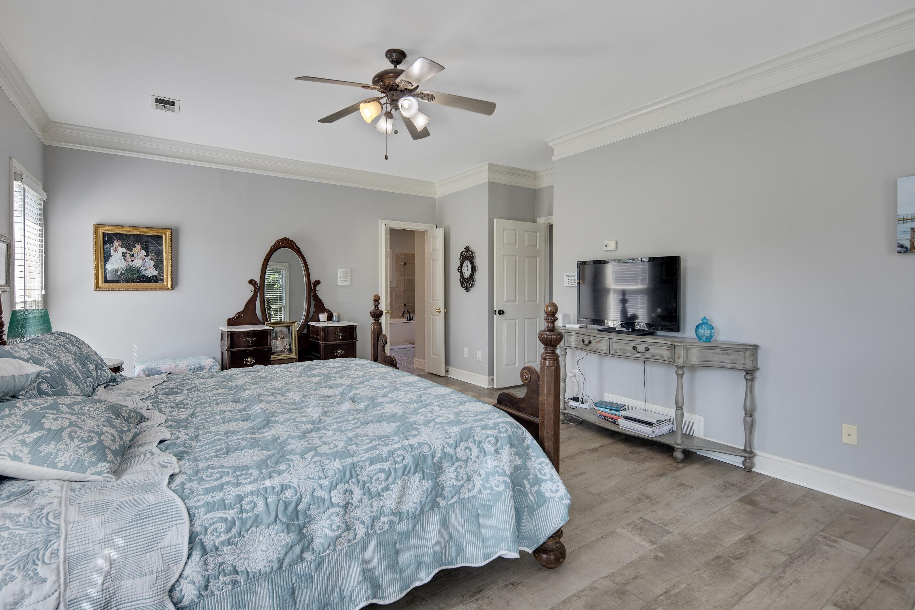 1323 Colbert Cove Collierville, TN 38017 - Photo 26 of 40 Bedroom featuring crown molding, hardwood / wood-style floors, and ceiling fan