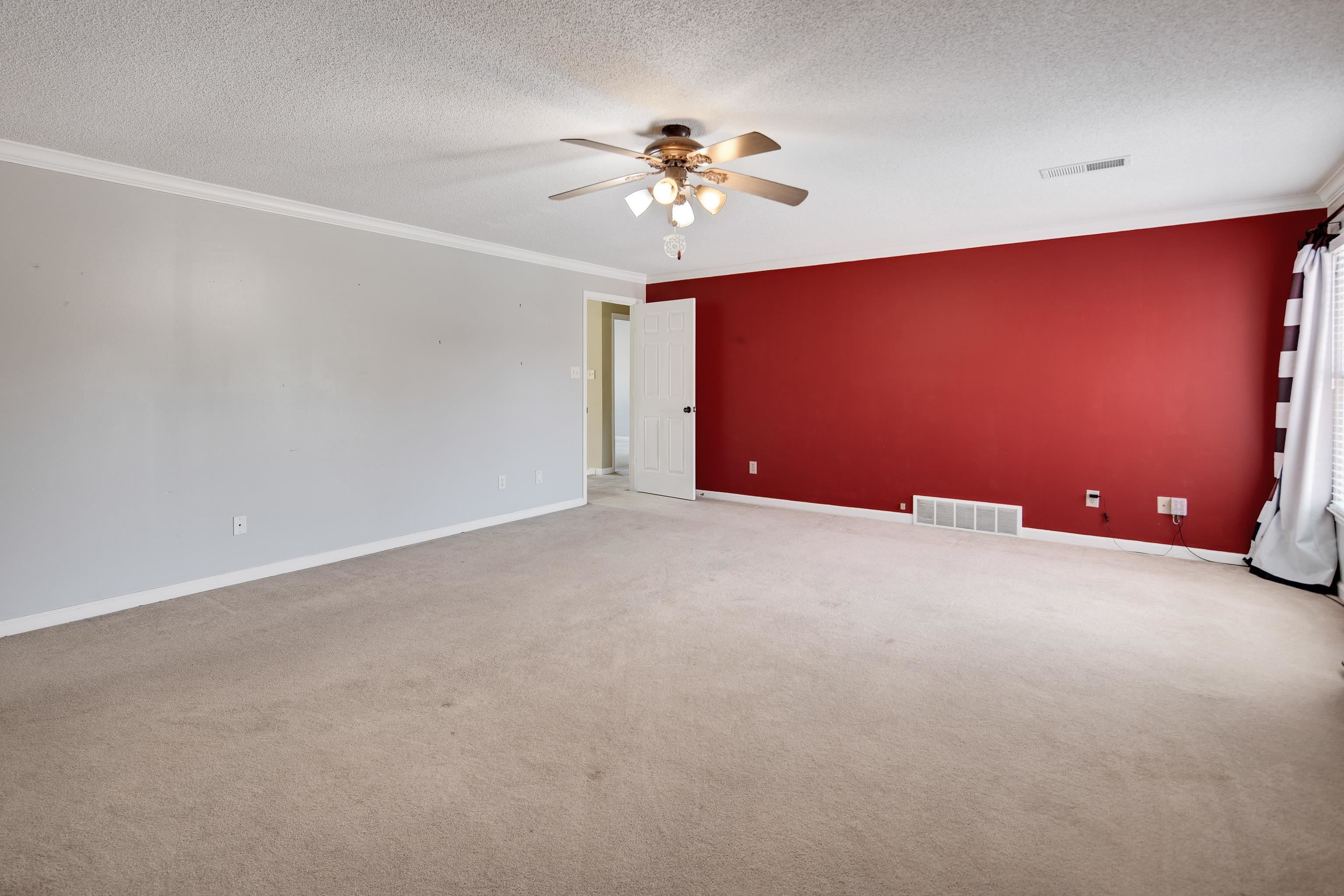 1323 Colbert Cove Collierville, TN 38017 - Photo 30 of 40 Carpeted empty room featuring ceiling fan, a textured ceiling, and crown molding