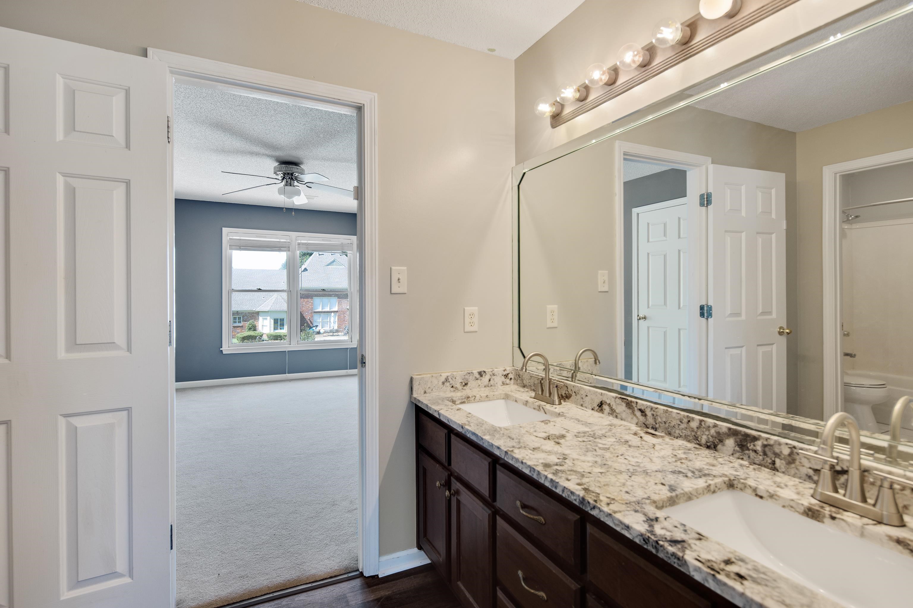 1323 Colbert Cove Collierville, TN 38017 - Photo 31 of 40 Bathroom with ceiling fan, vanity, toilet, and a textured ceiling