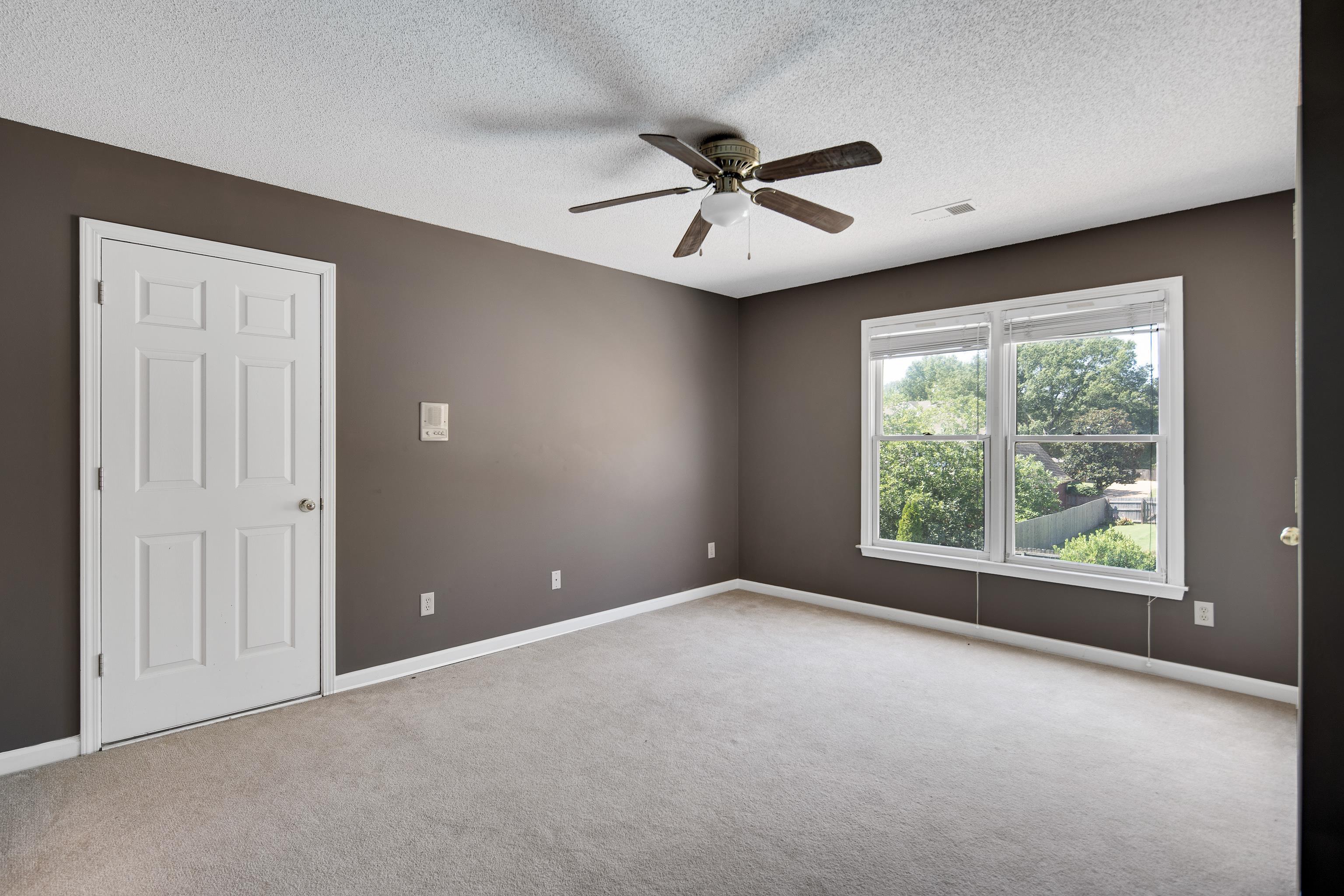 1323 Colbert Cove Collierville, TN 38017 - Photo 32 of 40 Unfurnished room with ceiling fan, light colored carpet, and a textured ceiling
