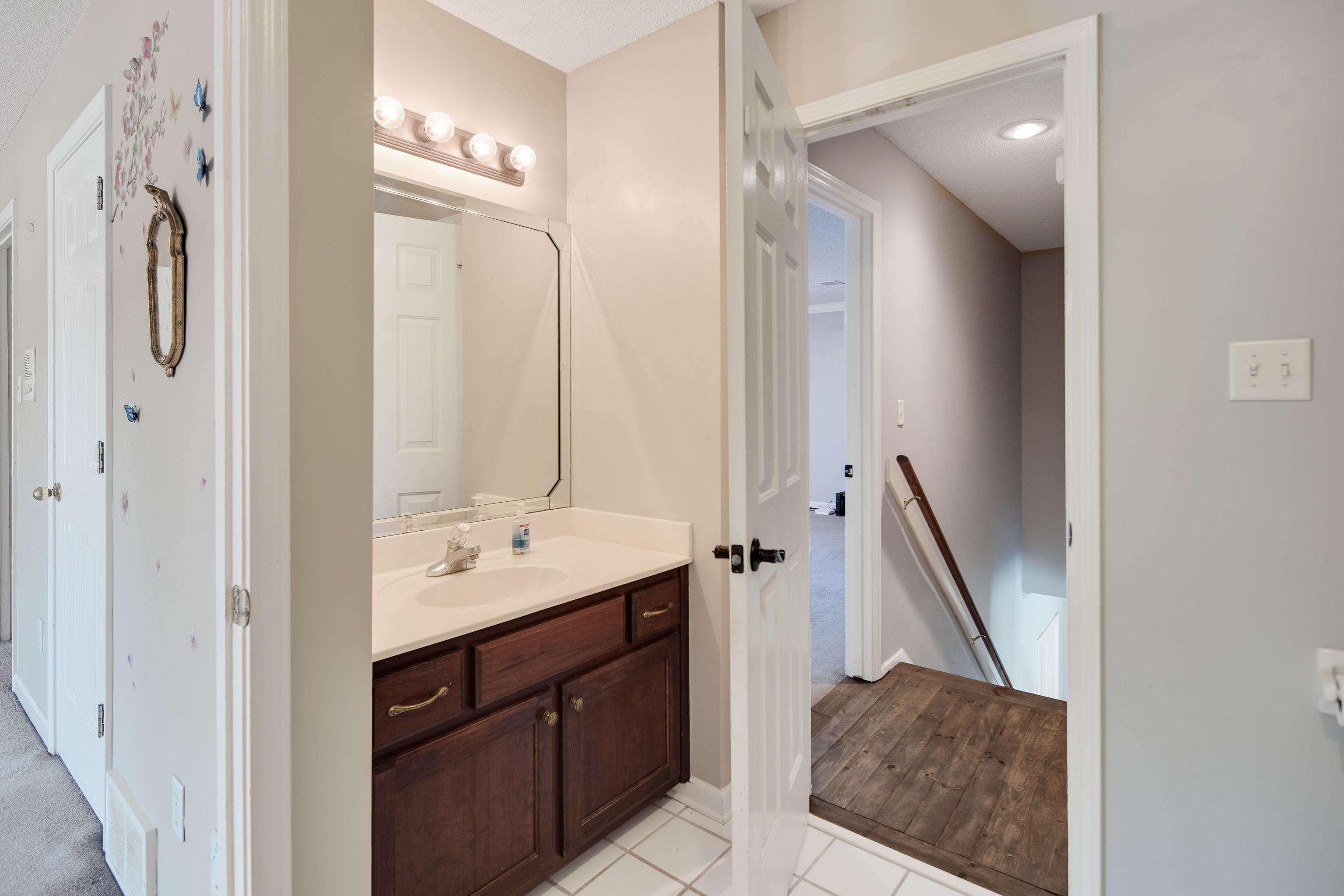 1323 Colbert Cove Collierville, TN 38017 - Photo 35 of 40 Bathroom with wood-type flooring and vanity