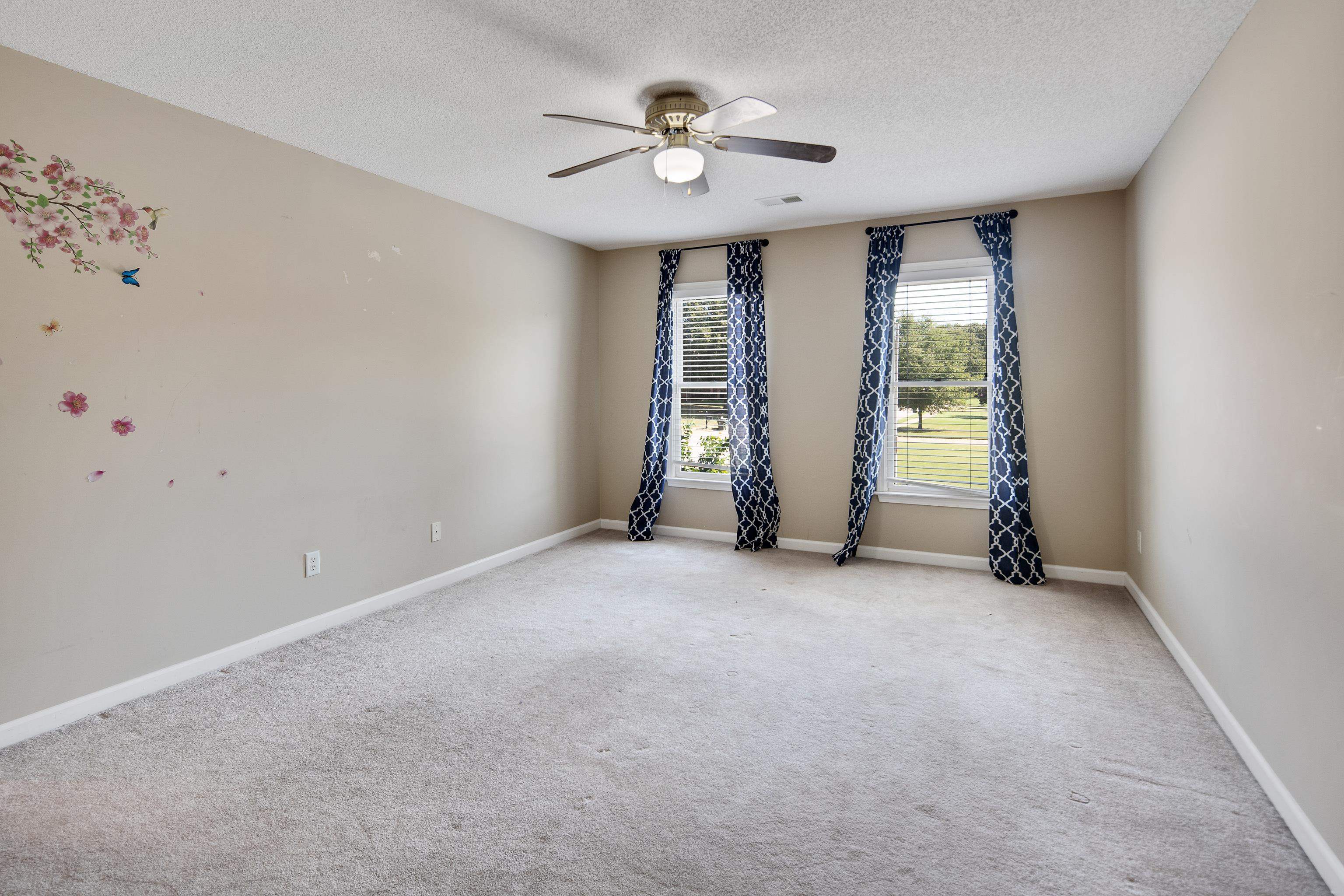 1323 Colbert Cove Collierville, TN 38017 - Photo 36 of 40 Carpeted empty room with ceiling fan and a textured ceiling