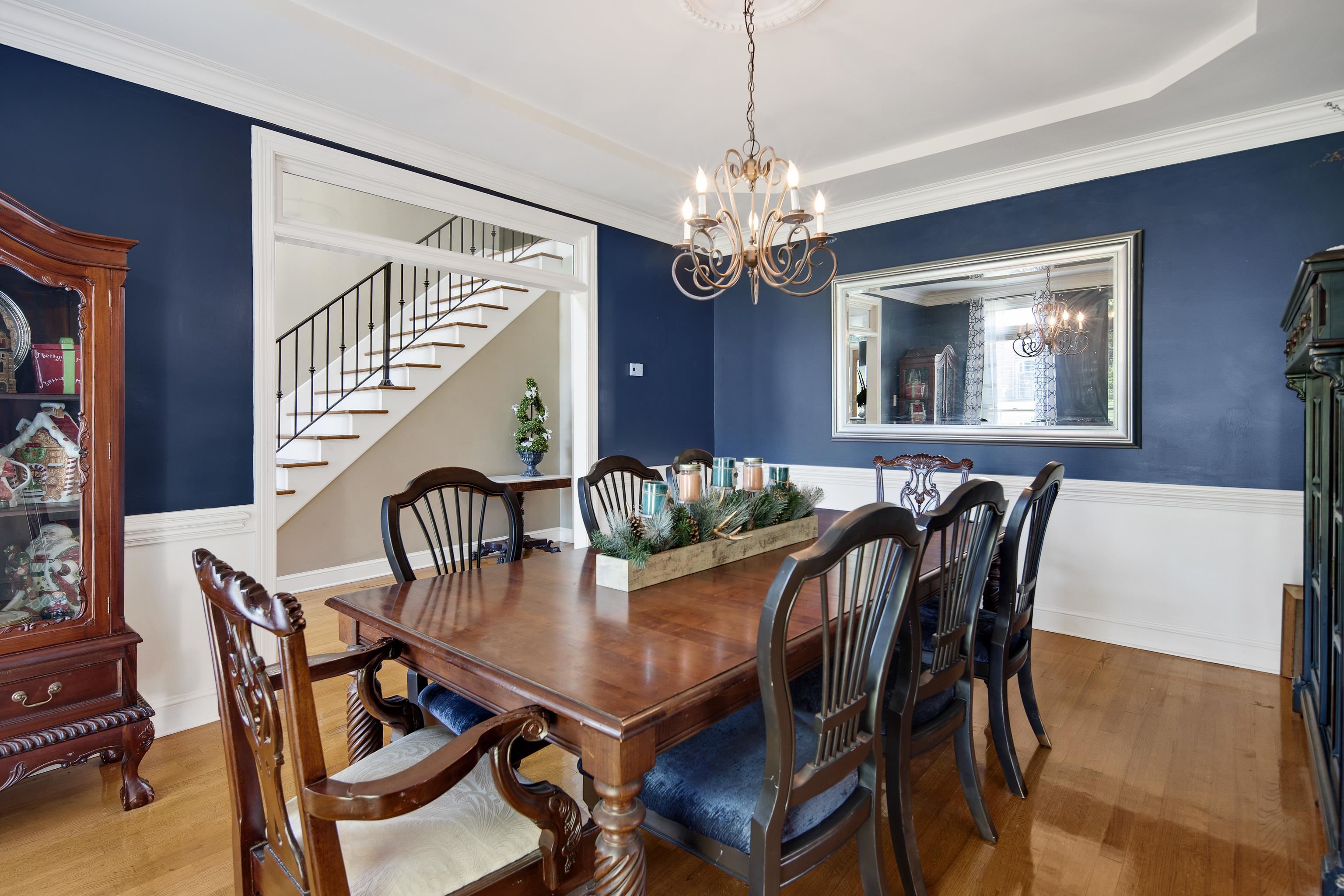 1323 Colbert Cove Collierville, TN 38017 - Photo 9 of 40 Dining room with wood-type flooring, crown molding, and a chandelier