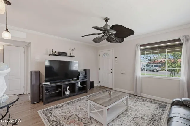 a living room with furniture and a flat screen tv