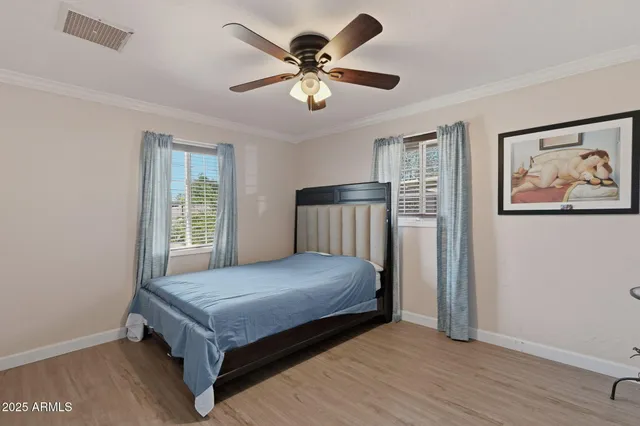 a bedroom with a bed and window