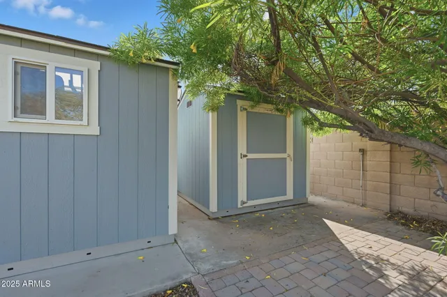 a view of a house with a tree