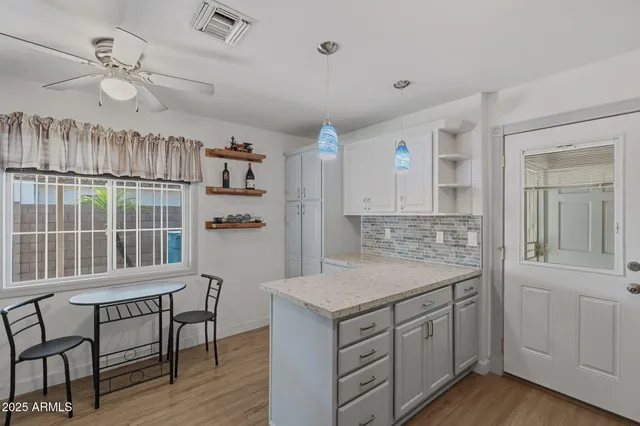 a kitchen that has a cabinets and a stove