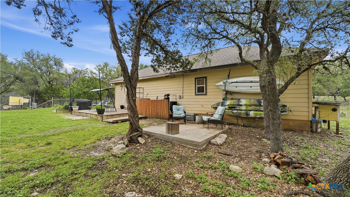 2216 Hornsby Spring Branch, TX 78070 - Photo 8 of 33 a view of a backyard with sitting area