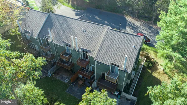 an aerial view of a houses with a outdoor space