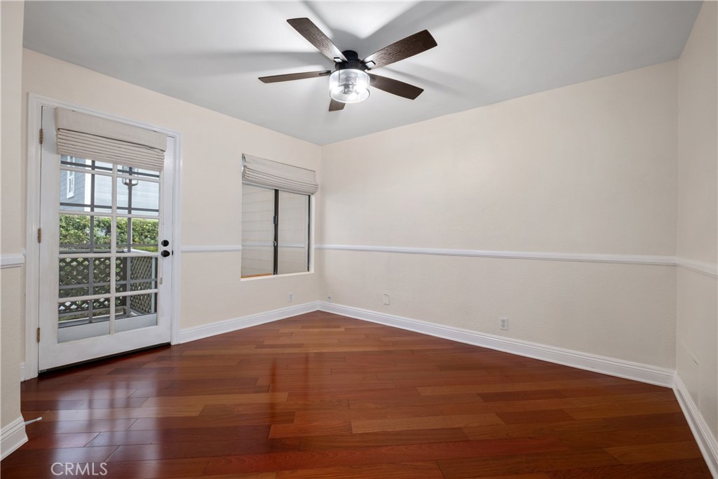 7 Oak Spring Lane, Unit 319 Aliso Viejo, CA 92656 - Photo 18 of 37 an empty room with wooden floor and windows