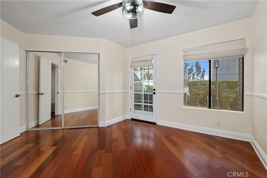 7 Oak Spring Lane, Unit 319 Aliso Viejo, CA 92656 - Photo 19 of 37 a view of an empty room with wooden floor and a window