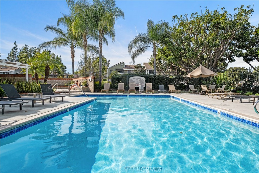 7 Oak Spring Lane, Unit 319 Aliso Viejo, CA 92656 - Photo 29 of 37 a swimming pool with outdoor seating and yard
