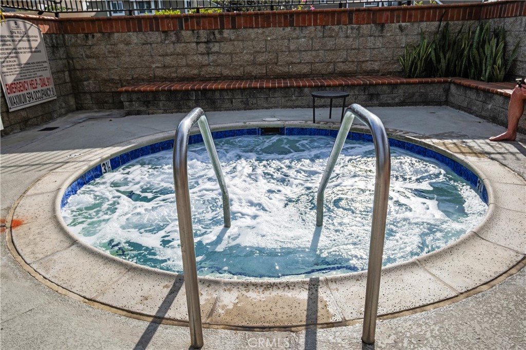 7 Oak Spring Lane, Unit 319 Aliso Viejo, CA 92656 - Photo 31 of 37 a view of a living room with a fireplace