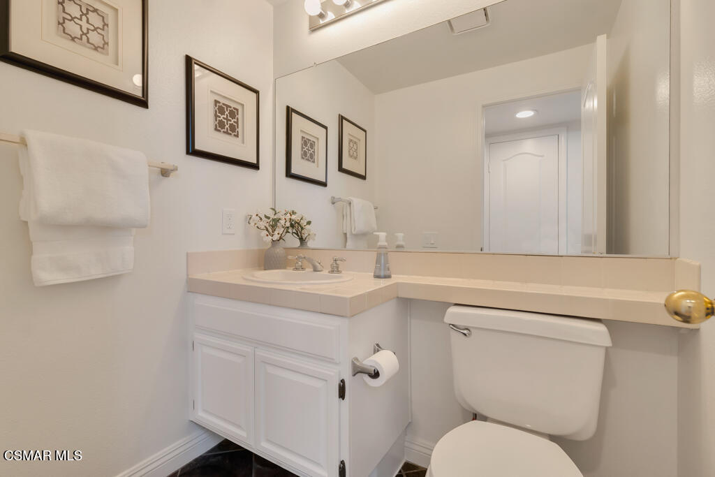 3842 Timberridge Road Moorpark, CA 93021 - Photo 26 of 75 a bathroom with a toilet sink and mirror