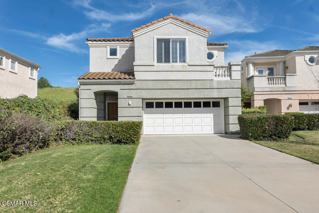 3842 Timberridge Road Moorpark, CA 93021 - Photo 3 of 75 a front view of a house with a yard and garage