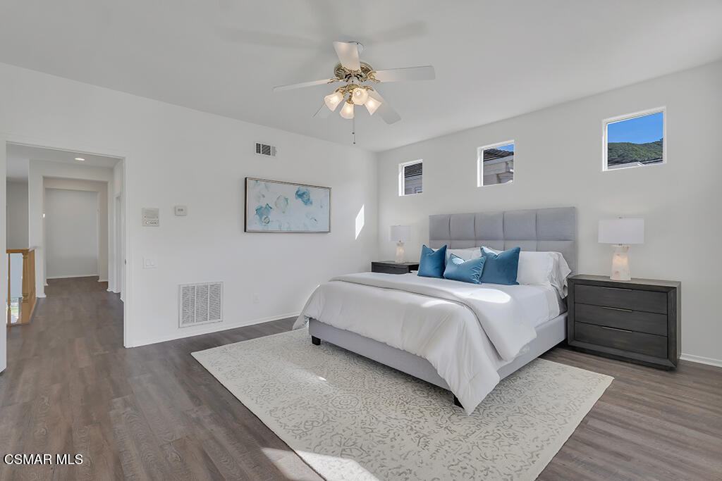 3842 Timberridge Road Moorpark, CA 93021 - Photo 37 of 75 a bedroom with a bed and a chandelier