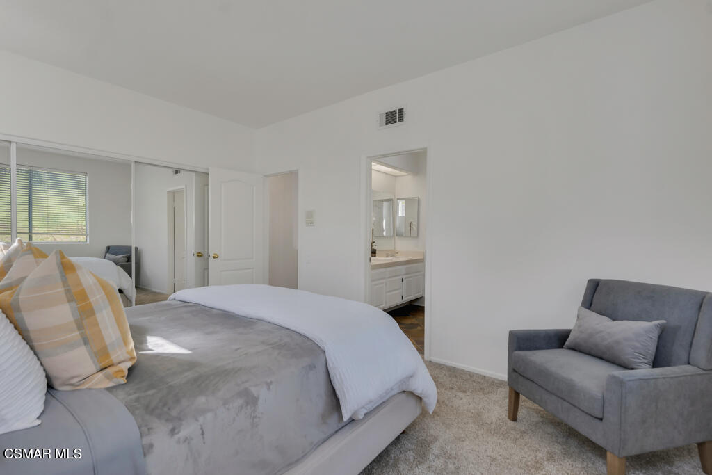 3842 Timberridge Road Moorpark, CA 93021 - Photo 44 of 75 a spacious bedroom with a bed and a couch