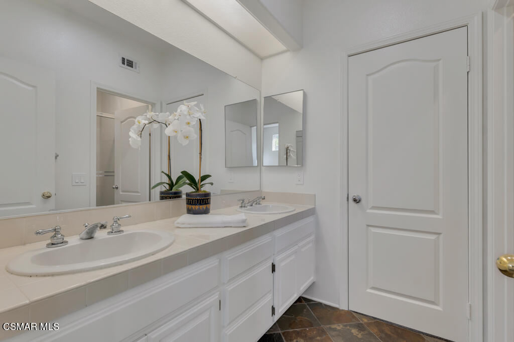 3842 Timberridge Road Moorpark, CA 93021 - Photo 45 of 75 a bathroom with double sink and a mirror