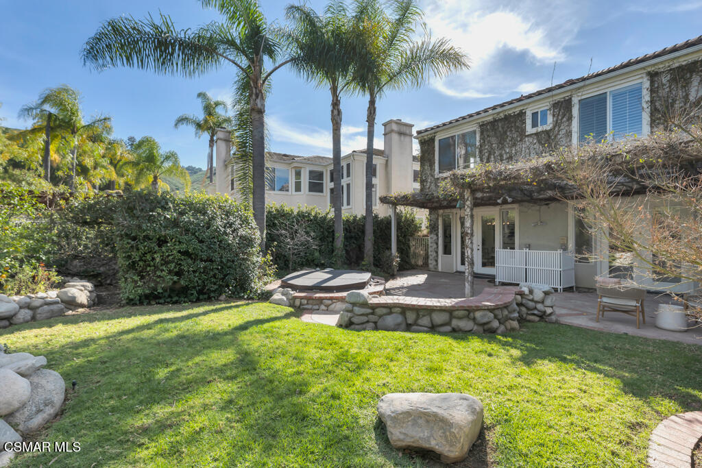 3842 Timberridge Road Moorpark, CA 93021 - Photo 50 of 75 a front view of a house with swimming pool and garden