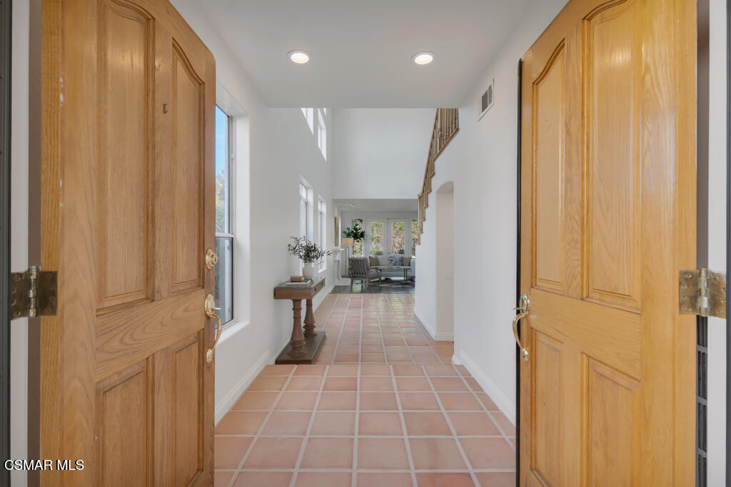 3842 Timberridge Road Moorpark, CA 93021 - Photo 9 of 75 a view of a hallway with wooden floor and staircase