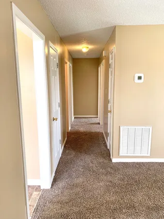 a view of hallway with livingroom