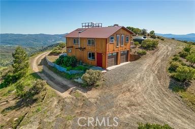 864 Watertrough Road Clearlake Oaks, CA 95423 - Photo 2 of 58 a front view of a house with a yard