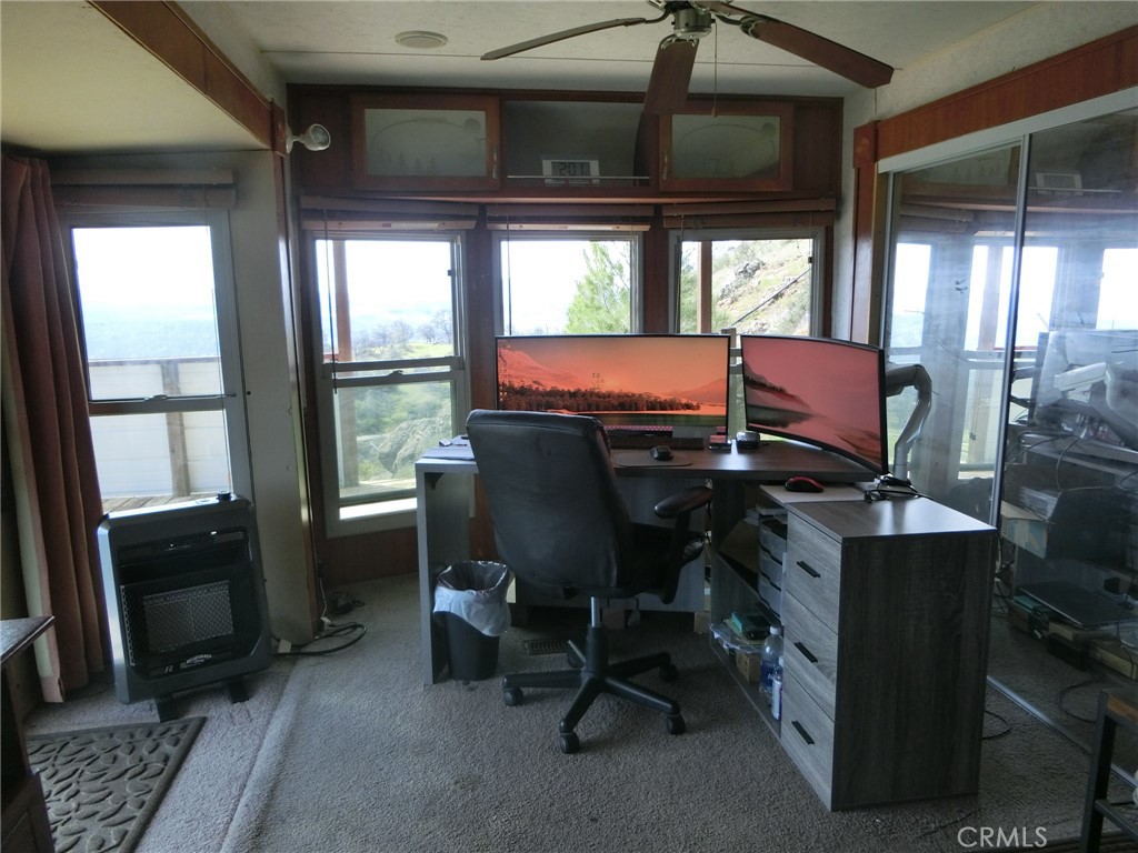 864 Watertrough Road Clearlake Oaks, CA 95423 - Photo 32 of 58 a view of a workspace with furniture and a window