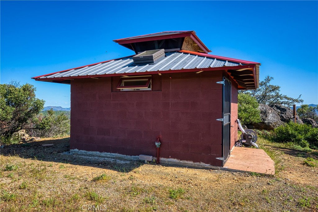 864 Watertrough Road Clearlake Oaks, CA 95423 - Photo 43 of 58 a front view of a house with a yard