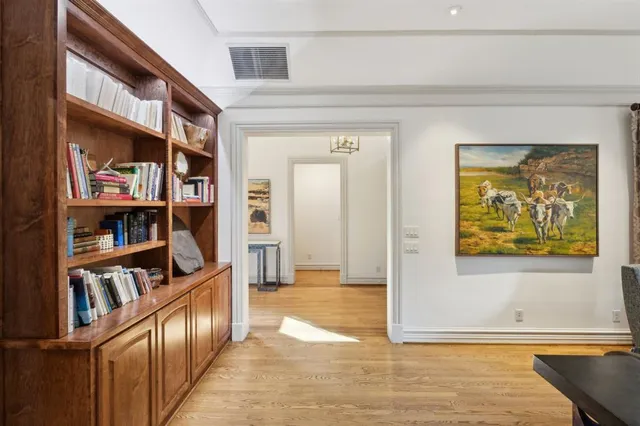 a view of an entryway with wooden floor