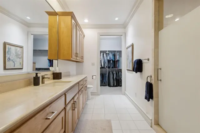 a kitchen with a refrigerator and a sink