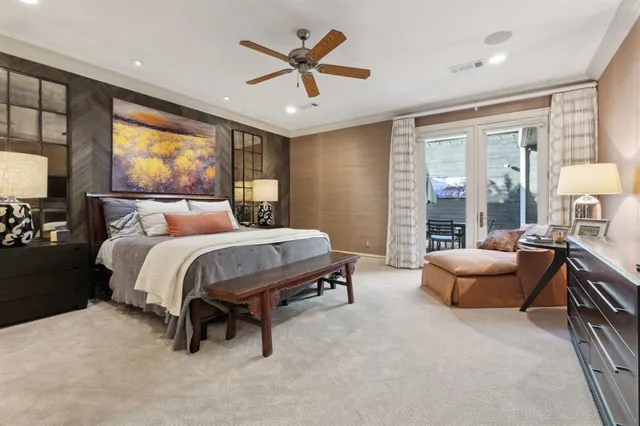 a bed room with furniture and a large window