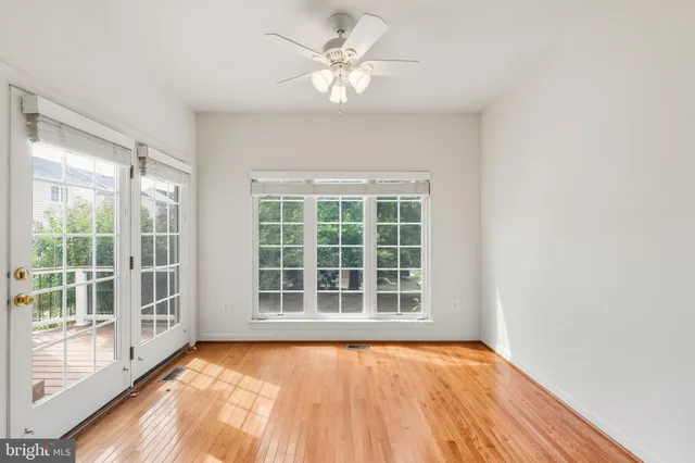a view of a balcony with wooden floor