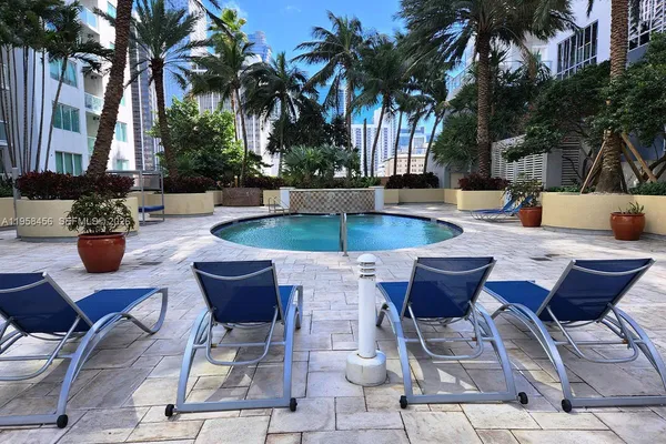 a view of outdoor sitting area with swimming pool