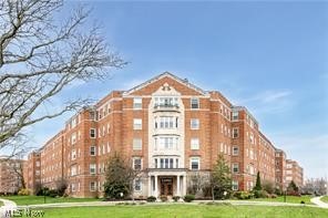 13800 Fairhill Road, Unit 416 Shaker Heights, OH 44120 - Photo 1 of 13 Brick multi-story building featuring a prominent central entrance with columns and a decorative balcony