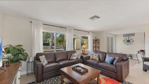 a living room with furniture and a rug