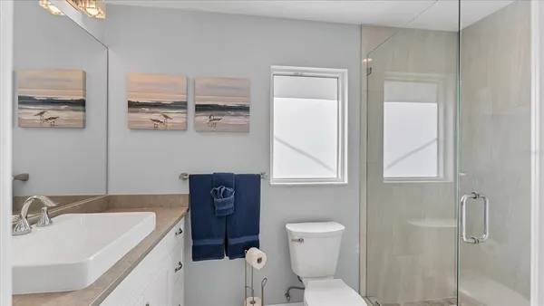 a spacious bathroom with a double vanity sink mirror and double