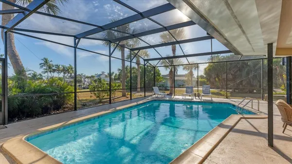 a view of swimming pool with outdoor seating