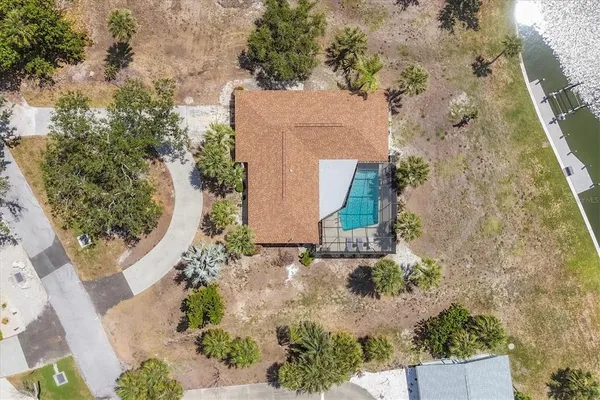 an aerial view of a house with a yard