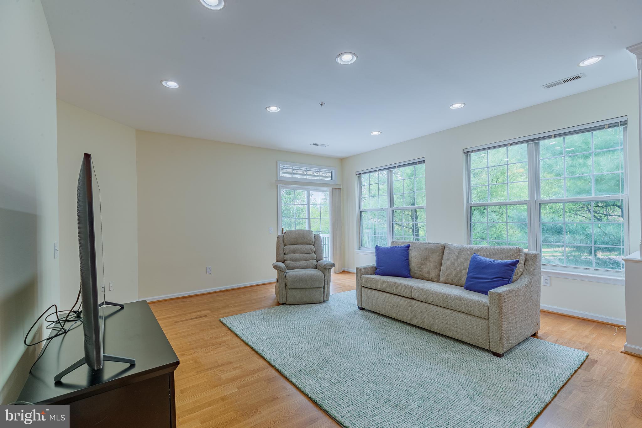 1549 Nicklaus Drive Springfield, PA 19064 - Photo 21 of 45 Living Room windows allows nature in