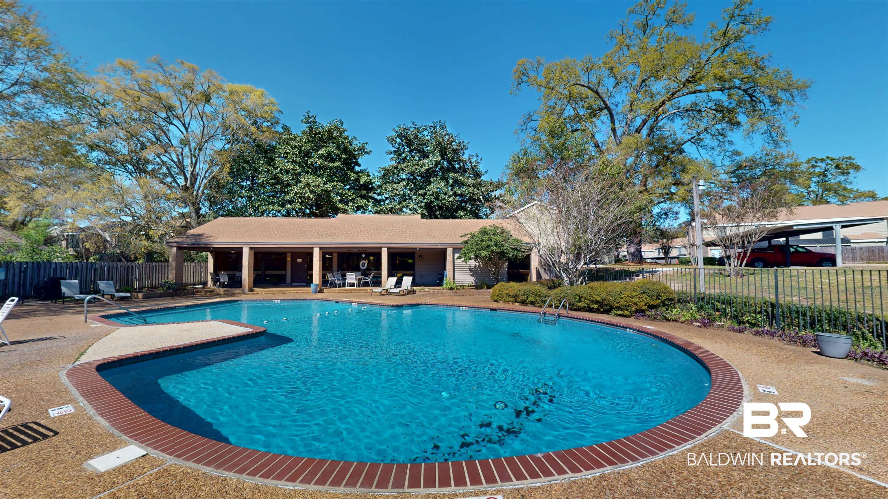 2901 Grant Street, Unit 902 Mobile, AL 36606 - Photo 29 of 35 Community pool featuring a patio