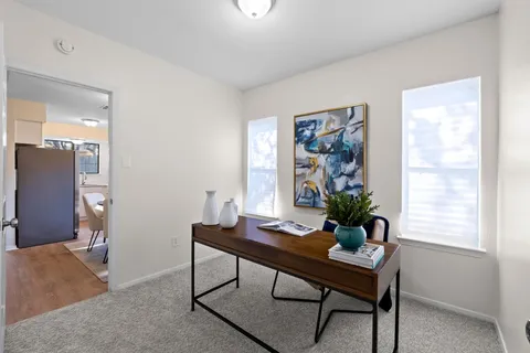 a view of a room with furniture window and wooden floor