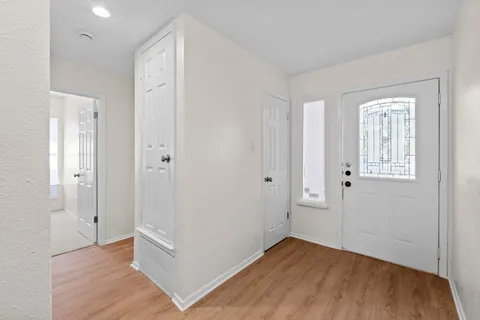 an empty room with wooden floor