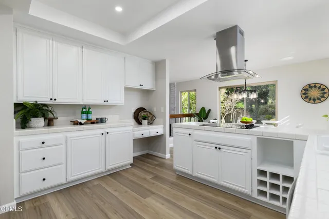 a kitchen with cabinets a sink and appliances