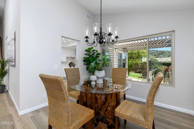 a view of a dining room with furniture window and outside view